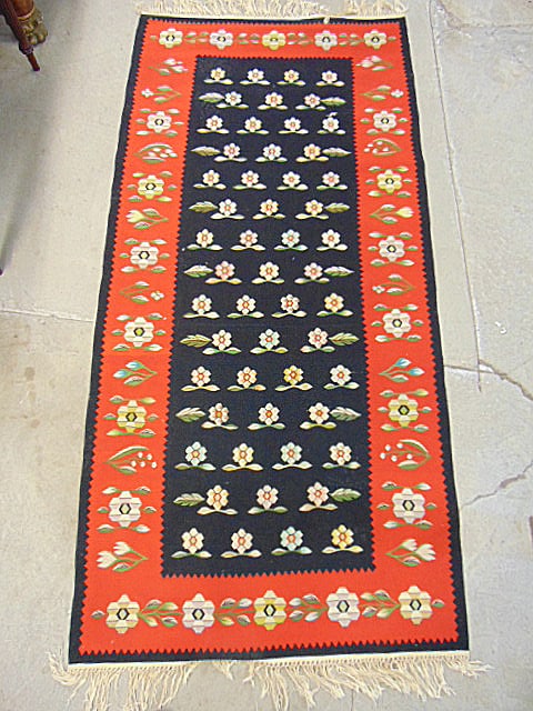 Flatweave carpet with floral center & red border, rug is 82" by 39.5": Flatweave carpet with floral center & red border, rug is 82" by 39.5"