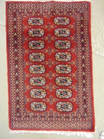 Small Bokhara scatter rug in dark red, carpet is 39" by 25.5"