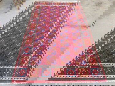 Carpet in red with block pattern, rug is 8'6" by 4'11"