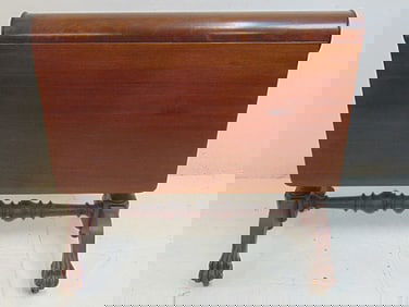 Mahogany Chippendale rolling pin drop leaf table with claw feet, one foot is missing a toe, folded