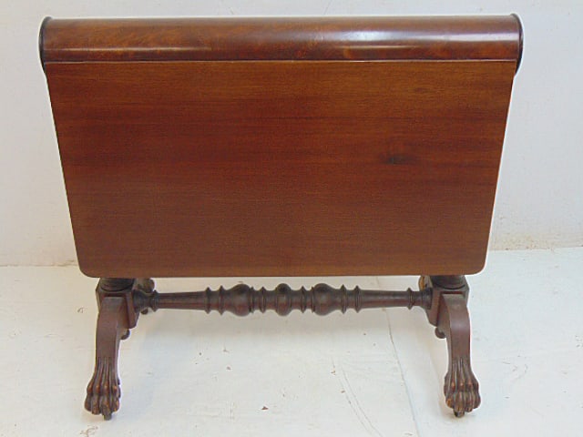 Mahogany Chippendale rolling pin drop leaf table with claw feet, one foot is missing a toe, folded: Mahogany Chippendale rolling pin drop leaf table with claw feet, one foot is missing a toe, folded table measures 34.25" wide, 19" deep (at ground level, feet), & 30.75" tall, opened table measures 36