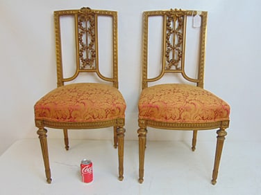 Pair carved gilt wood side chairs with upholstered seats, floral & ribbon carved back, chairs are