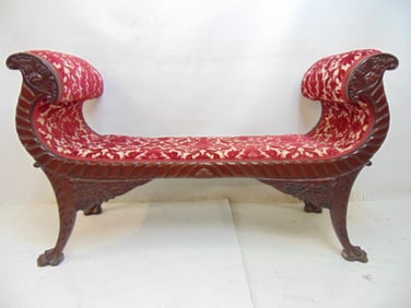 Upholstered bench with carved wood, cornucopia arms, claw feet, carved on both sides, bench is 46"
