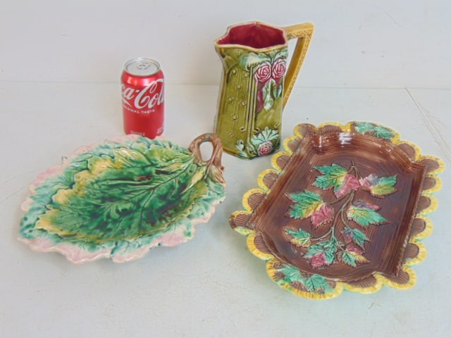 Majolica lot, two leaf decorated trays & floral decorated pitcher, larger tray is 15" by 9", pitcher: Majolica lot, two leaf decorated trays & floral decorated pitcher, larger tray is 15" by 9", pitcher is 7 1/8" tall, in good condition