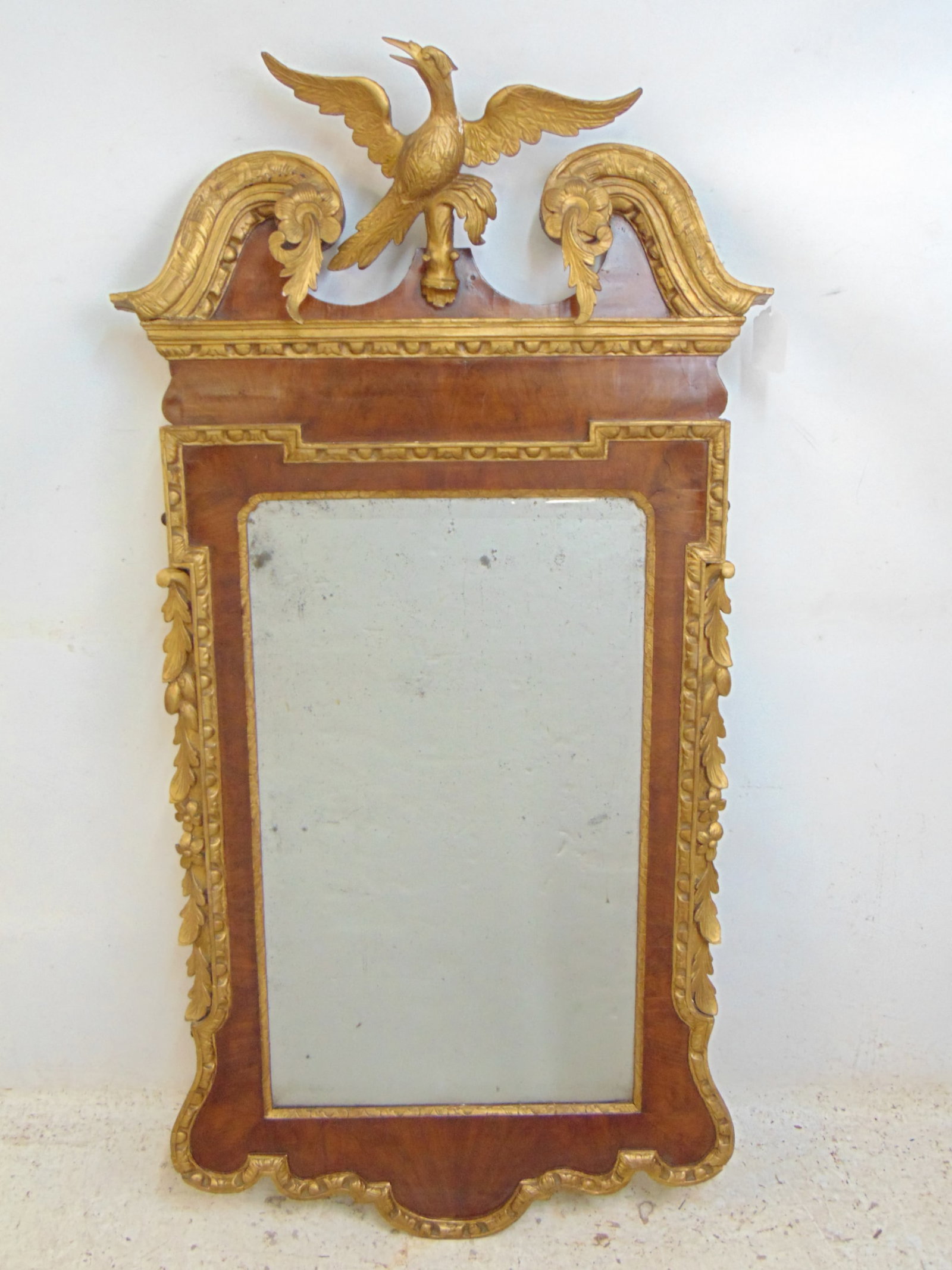 Antique English Georgian or American federal carved mirror with phoenix bird carved top, gilt detail: Antique English Georgian or American federal carved mirror with phoenix bird carved top, gilt detail, mirror is 57" tall, 27.25" wide, some loss of gesso, gilt on side of bird.