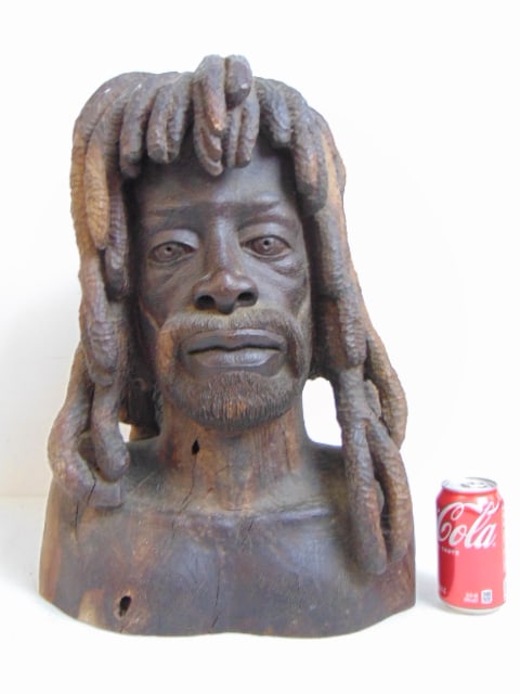 Carved wood bust of a Rastafarian by Cedric Hanson, 1975, "Ras Janny Binge", height is 20.5": Carved wood bust of a Rastafarian by Cedric Hanson, 1975, "Ras Janny Binge", height is 20.5"