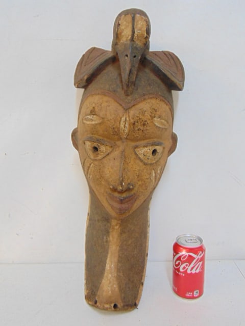 Carved African bird mask, paint decorated face, bird on head, height is 21.5",: Carved African bird mask, paint decorated face, bird on head, height is 21.5",