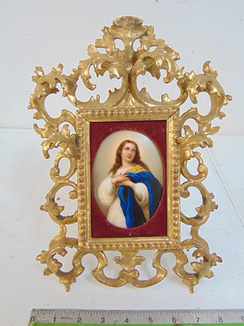 Porcelain oval plaque on elaborate gilt frame, portrait Madonna, plaque is 5" by 4", framed size is: Porcelain oval plaque on elaborate gilt frame, portrait Madonna, plaque is 5" by 4", framed size is 12.5" by 9.5", some loss on frame