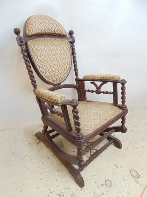 Hunzinger platform rocking chair, mahogany with spiral columns.: Hunzinger platform rocking chair, mahogany with spiral columns.