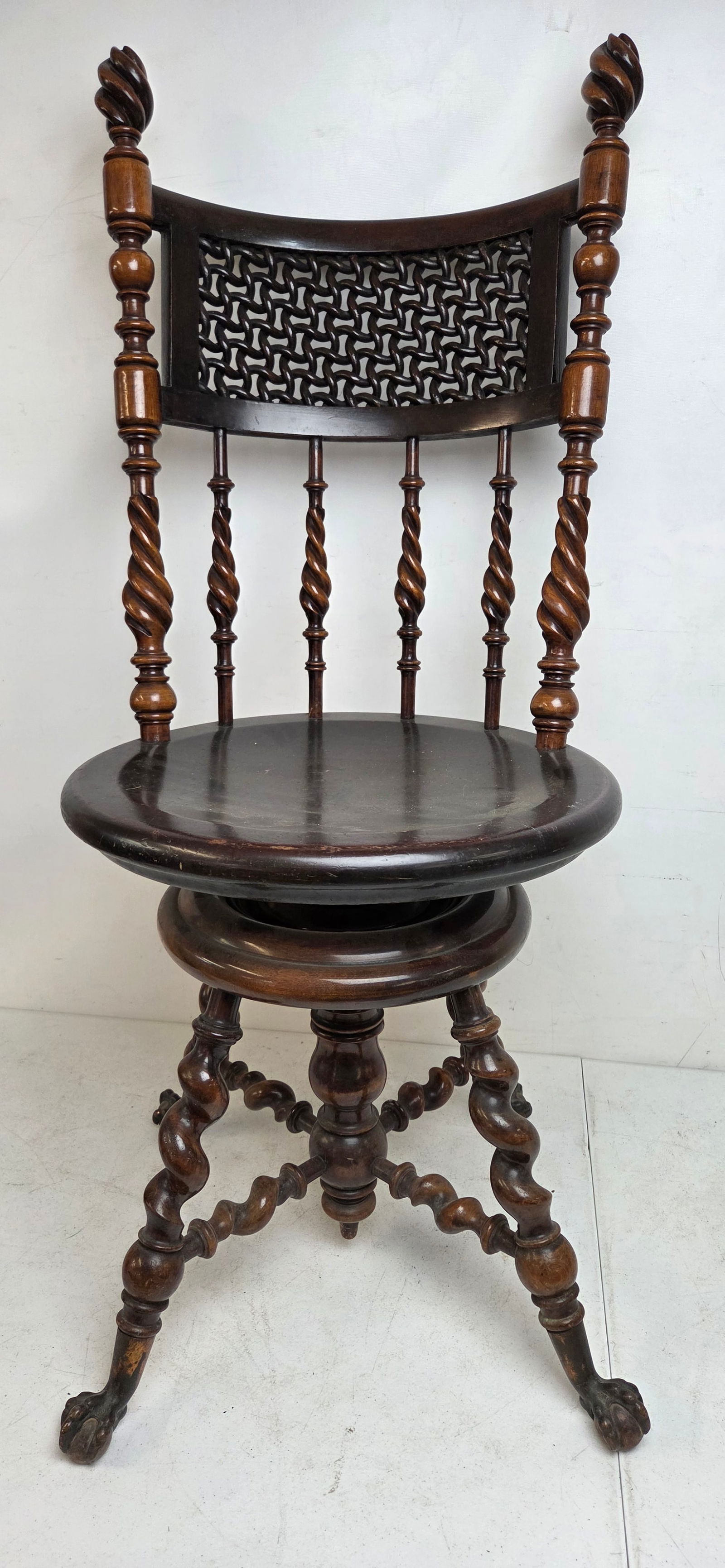 Merklen Brothers swivel chair with carved spiral columns, intricate fretwork back. (1 of 12)