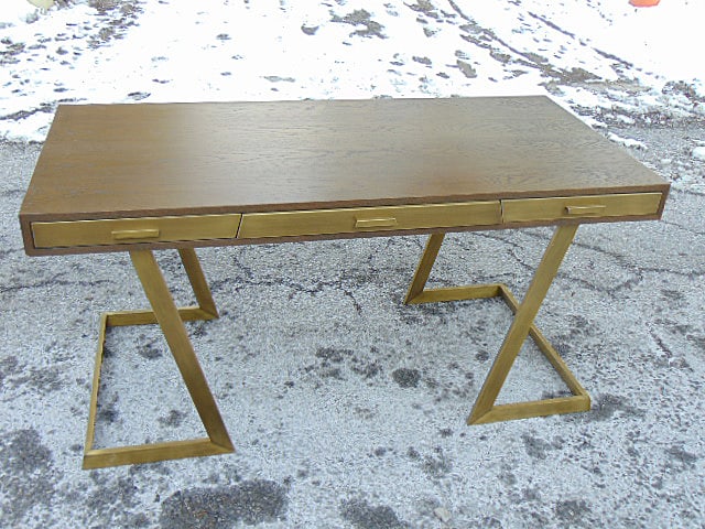 Onegin triple drawer desk on solid brass base by Julian Chichester, drawers lined with red leather: Onegin triple drawer desk on solid brass base by Julian Chichester, drawers lined with red leather (?), desk is 59" by 27.5", height is 29.5"