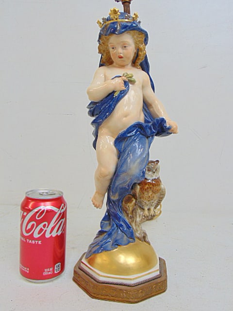 Meissen figural porcelain lamp, "night", showing a putti with a dark blue cloak, height is 14 5/8": Meissen figural porcelain lamp, "night", showing a putti with a dark blue cloak, height is 14 5/8" (base to head figure), total height including harp is 26", in good condition.