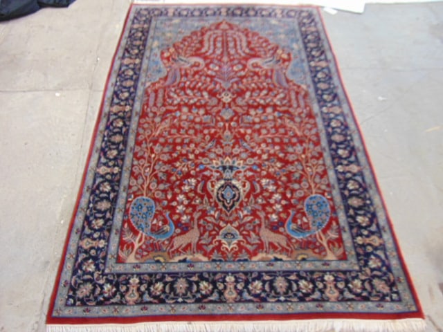 Carpet in red with various animals, peacocks, giraffe, exotic birds, rug is 97" by 61.5": Carpet in red with various animals, peacocks, giraffe, exotic birds, rug is 97" by 61.5"