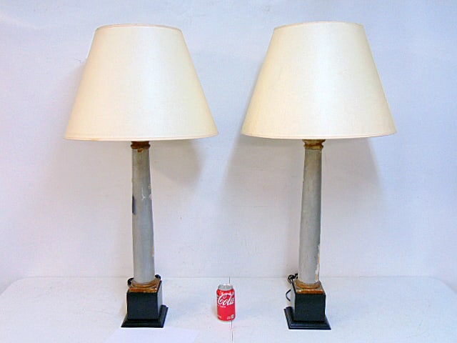 Pair carved wood painted column lamps, black bases, silver painted columns, with shades, lamps are (1 of 4)