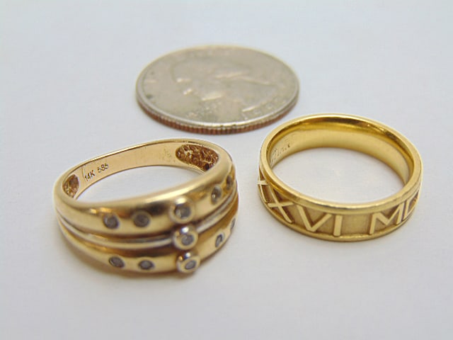 Jewelry. (2) Gold rings to include 18kt Gold John Christian Design roman numeral band, 4.85 grams, (1 of 5)