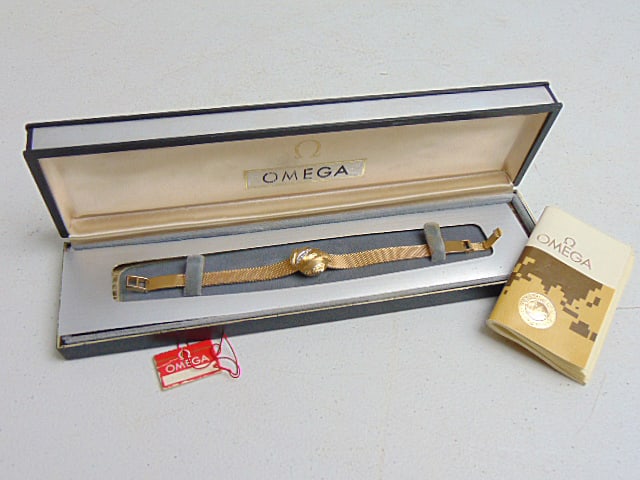 Jewelry. Vintage Gold OMEGA 14kt wristwatch, original box, hidden diamond gold leaf, 6 small (1 of 7)