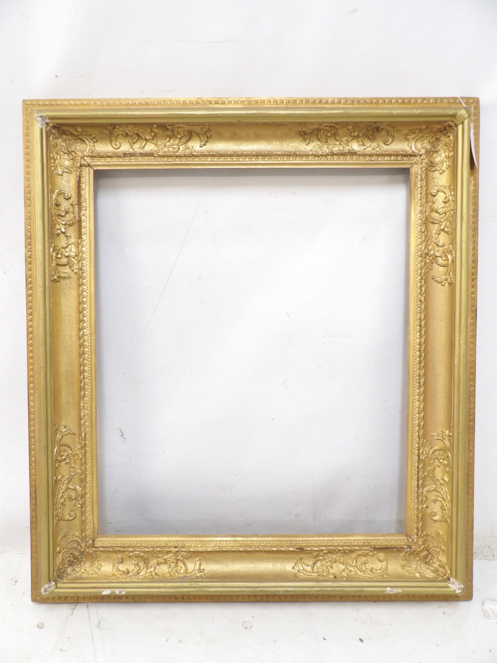 Antique carved wood frame, gold painted, opening is 25" by 29", outside is 34.25" by 38.5" (1 of 4)