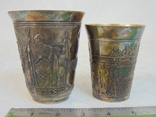 Two Henryk Winograd silver Kiddush cups, both extensively decorated, one with various figures, (1 of 9)