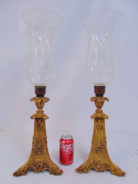 Pair Spelter candle holders with etched hurricane shades, bases are gold painted with intricate: Pair Spelter candle holders with etched hurricane shades, bases are gold painted with intricate designs, total height is 24.5"
