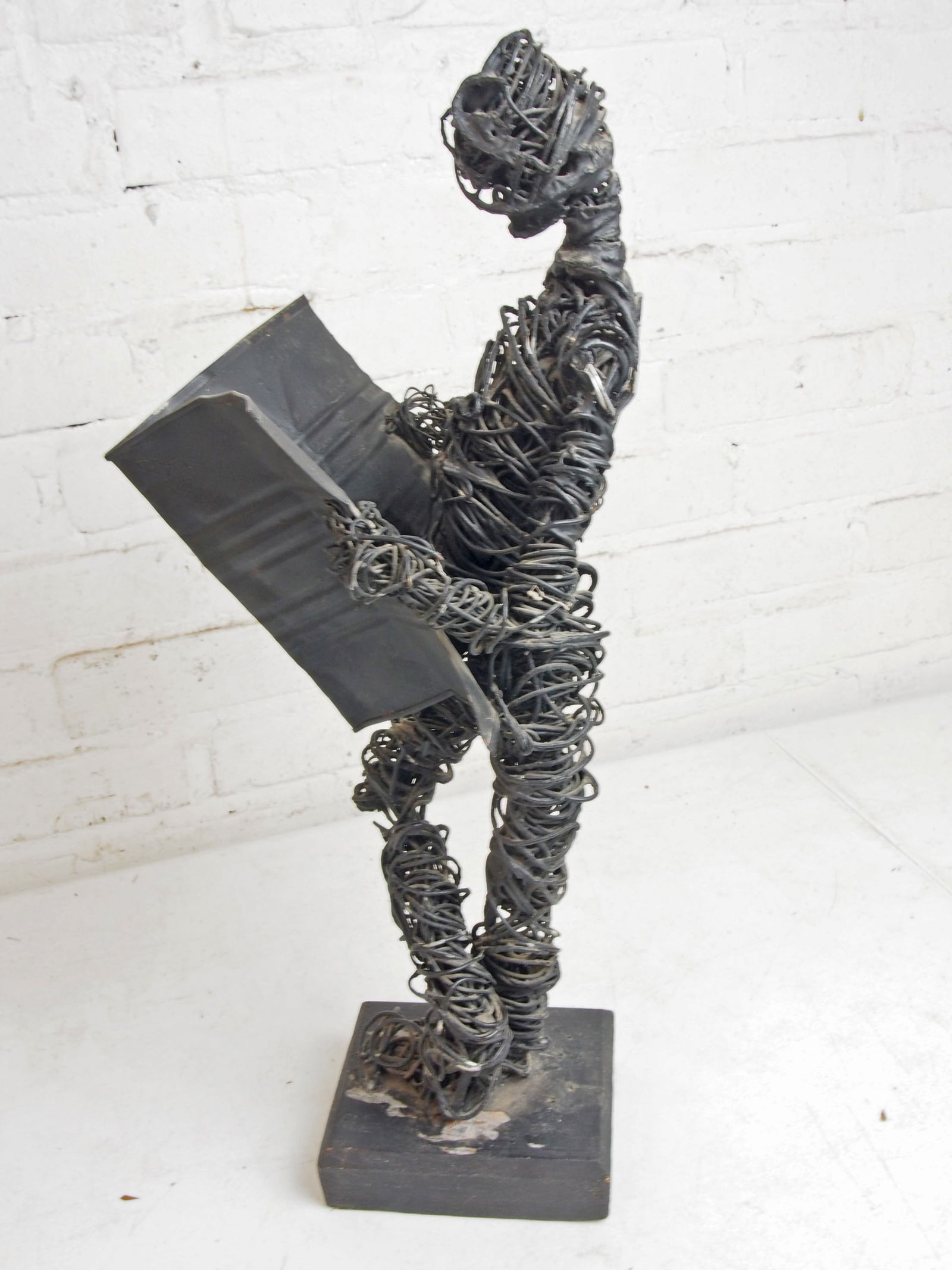 Figural wire sculpture, Eduardo Torres, on wood base, man reading paper, height is 21.5" (1 of 5)