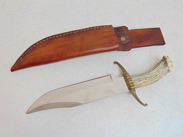 Large bone handled bowie knife in leather sheath, 14", few minor rust spots on blade (1 of 4)