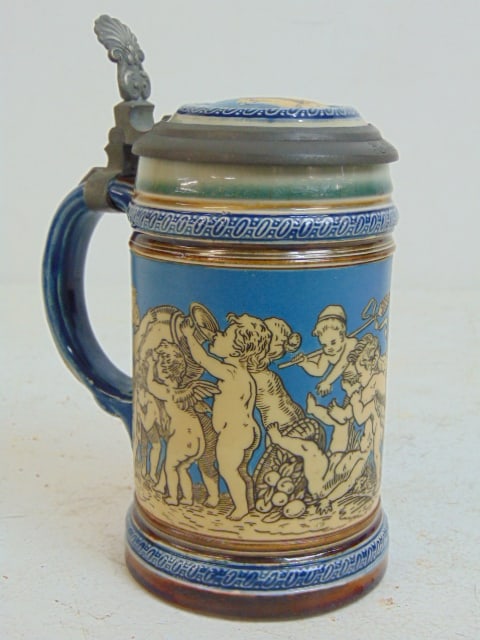 Mettlach beer stein, decorated with a parade of putties, pewter lined lid, height is 6.75" (1 of 5)