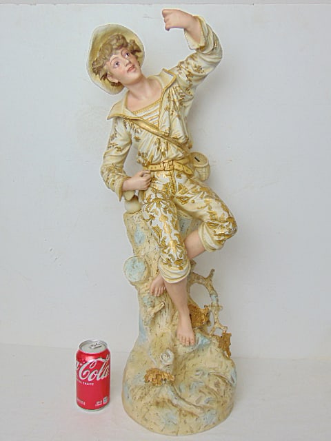Large Rudolstadt bisque porcelain figure of a young man in floral decorated clothing with gilt: Large Rudolstadt bisque porcelain figure of a young man in floral decorated clothing with gilt accents, height is 28.25"