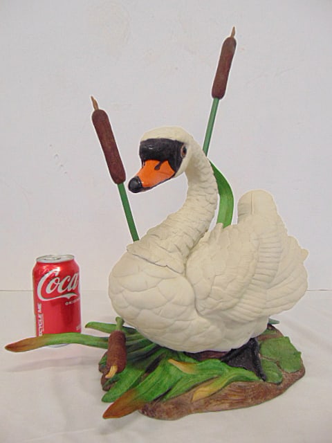 Boehm Porcelain "Mute Swan", number 44", one cattail and one leaf are reglued, 16.5" by 10", height: Boehm Porcelain "Mute Swan", number 44", one cattail and one leaf are reglued, 16.5" by 10", height is 18.75", one stem or leaf is missing (see images)