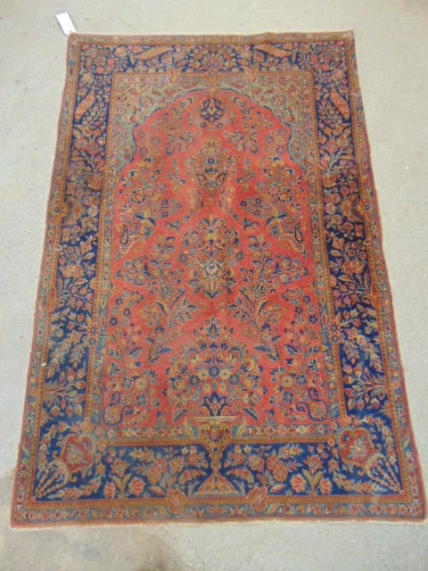 Kashan or Sarouk carpet in red, blue border, with extensive floral decoration, rug is 80" by 52" (1 of 5)