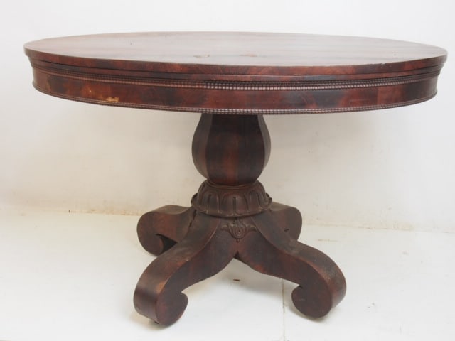 Oval mahogany empire center table, table is 45.5" by 34", height is 29" (1 of 3)