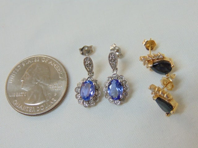 Jewelry. (2) Pairs of gold earrings, white gold tanzanite post earrings, hallmark 14k, oval: Jewelry. (2) Pairs of gold earrings, white gold tanzanite post earrings, hallmark 14k, oval tanzanite approx. 6 mm surrounded by small round diamonds, 2.75 grams & yellow gold hallmark diamond earring