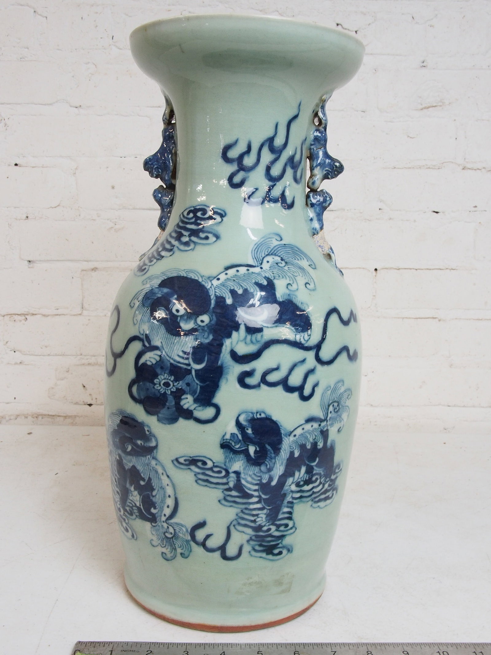 Chinese celadon vase with foo dog decoration, repair, missing glaze to both handles (see images),: Chinese celadon vase with foo dog decoration, repair, missing glaze to both handles (see images), 17" tall