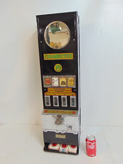 Vintage coin operated cigarette vending machine, black painted case with chrome detail, decals in (1 of 8)