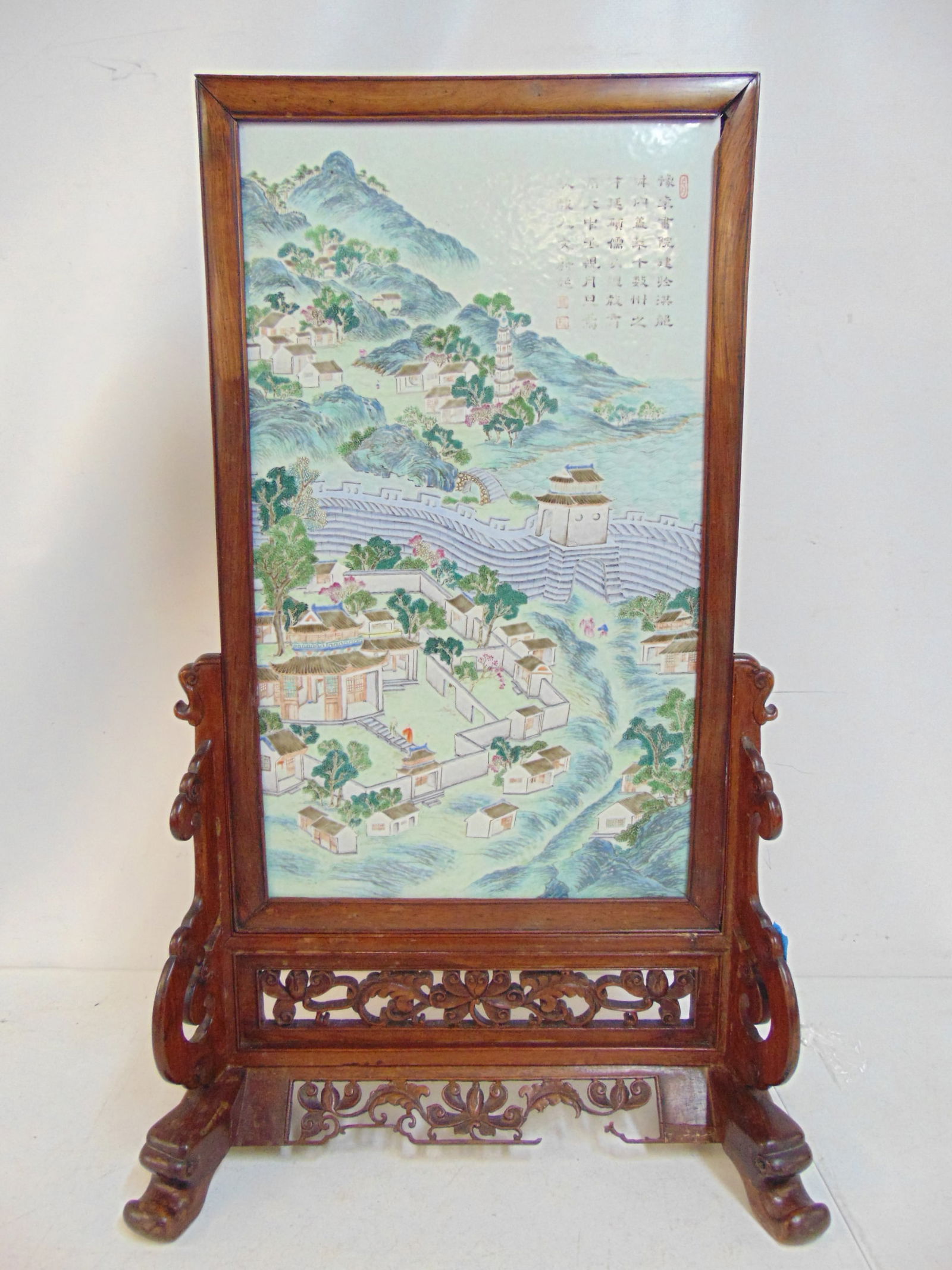 Chinese porcelain plaque on carved wood stand, scene shows a small Chinese village by the great wall (1 of 9)