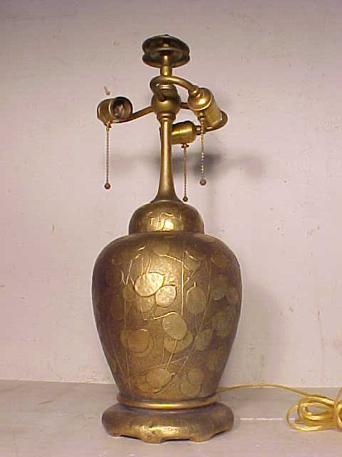Tiffany Studio's bronze lamp base: Tiffany Studio's bronze lamp base, no shade, signed on base, has leaf pattern on a dore finish, total height is 21.5". Hudson Valley Auctioneers has endeavored to accurately describe all items being s