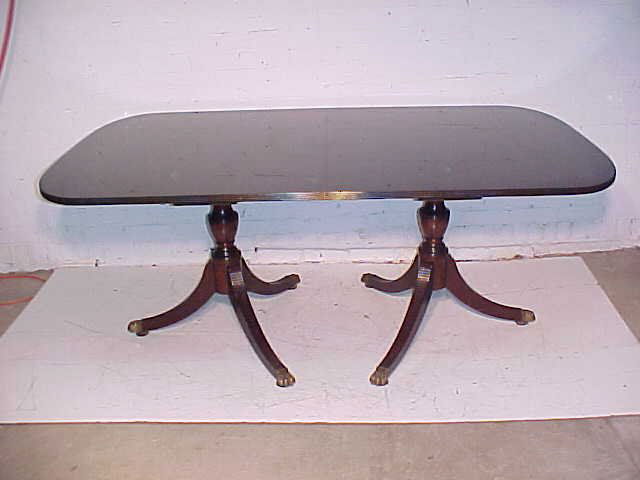 Dining room by Schmieg & Kotzian: Dining room table with 3 leaves, mahogany, by Schmieg & Kotzian, table itself is not signed, but the leaf rack is, table in good condition, varnish has light cracks. Hudson Valley Auctioneers has ende