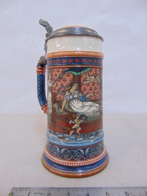 Mettlach beer stein, pewter lined lid, has decorative scene with woman on recliner, putti, in good (1 of 5)