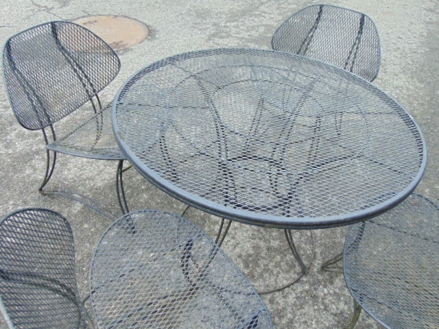 Mid Century iron round table with 4 chairs, in black, table is 42" in diameter, 27" high - 2