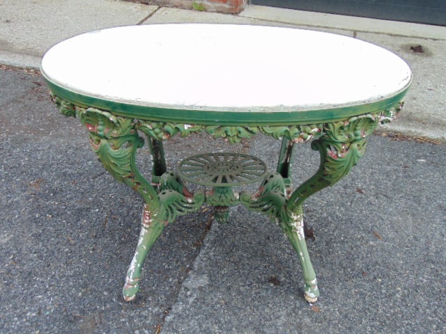 Victorian marble top iron base table, some loss, green painted base, white marble top, table is (1 of 9)
