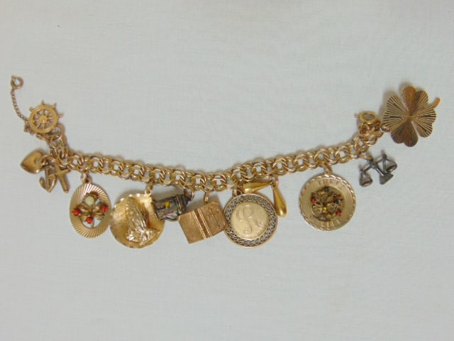 Jewelry. Vintage Gold Filled charm bracelet w/ 11 gold filled charms & 2 silverplate charms scale & (1 of 5)