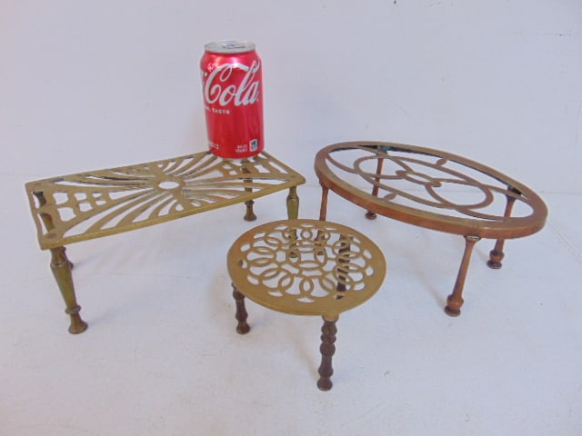 3 early brass trivets, oval, oblong & round, round trivet is 5.25", signed Peerage, England; oblong (1 of 6)