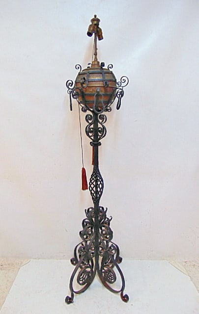 Large wrought iron piano floor lamp with brass round (electrified) oil reservoir, height is 66",: Large wrought iron piano floor lamp with brass round (electrified) oil reservoir, height is 66", ornate nase.