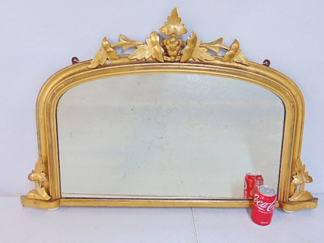 Decorative gilt mirror, straight bottom, curved top carved detail, mirror is 39.5" wide, 24.75" tall (1 of 4)
