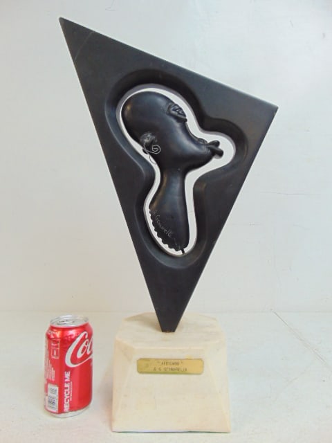 Carved black stone figure "Africano", by Anthony Gennarelli, figure inside stone triangle on white (1 of 6)