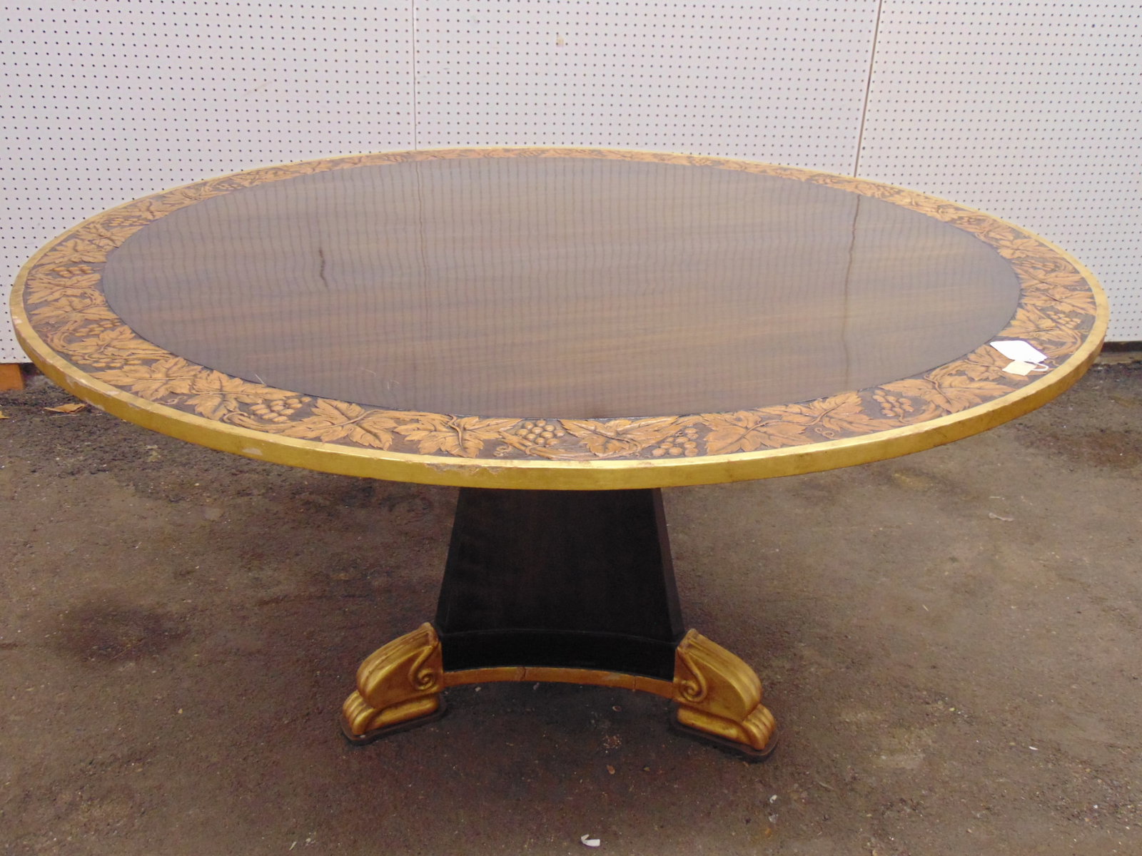 Round dining table with bronze gilt feet and top with carved grapevine pattern border, top has small (1 of 9)