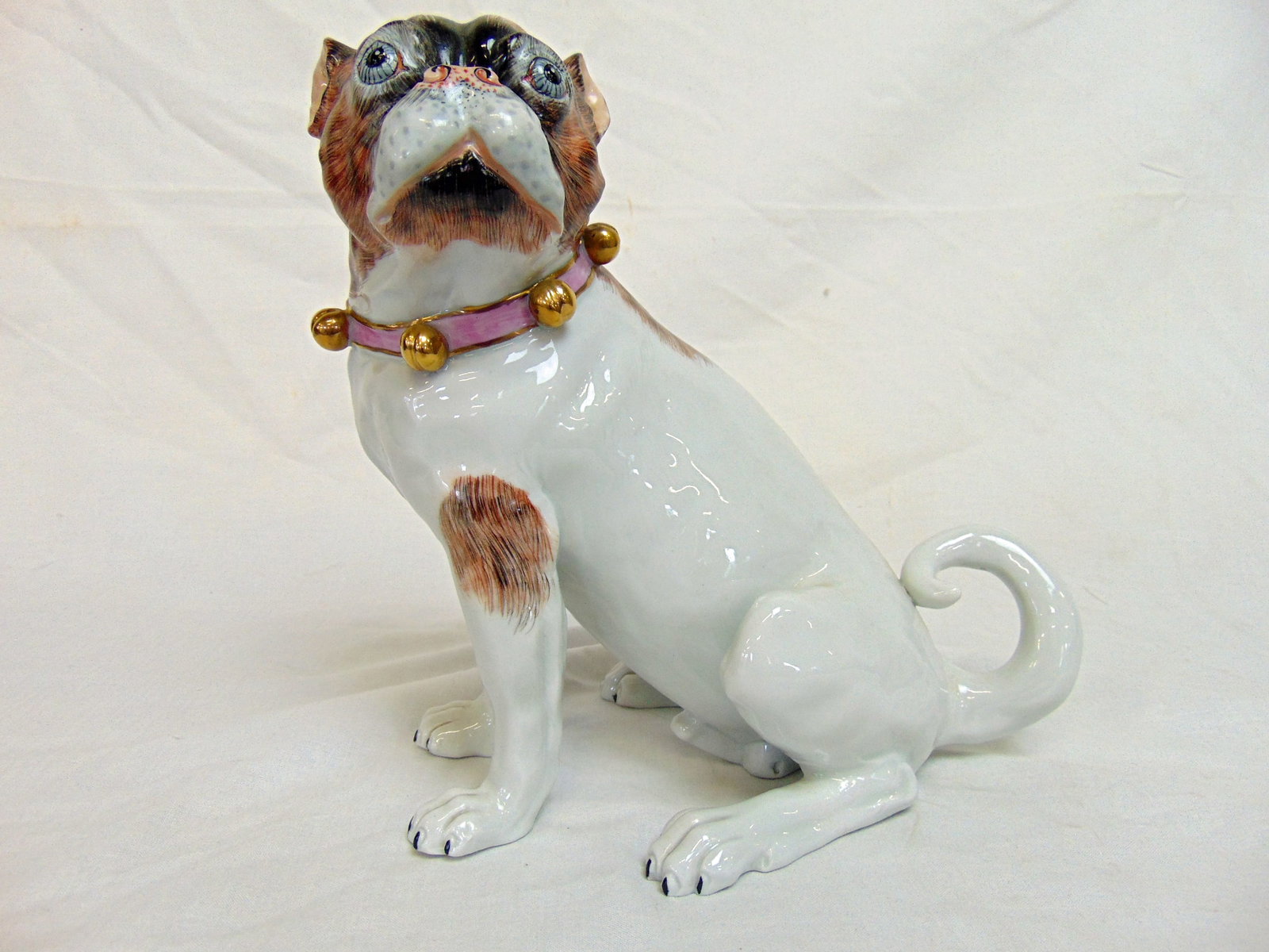 Dresden porcelain figure of a dog, Carl Thieme, sitting pug, good condition, 8 1/8" tall, 8.25": Dresden porcelain figure of a dog, Carl Thieme, sitting pug, good condition, 8 1/8" tall, 8.25" wide, 5" deep.