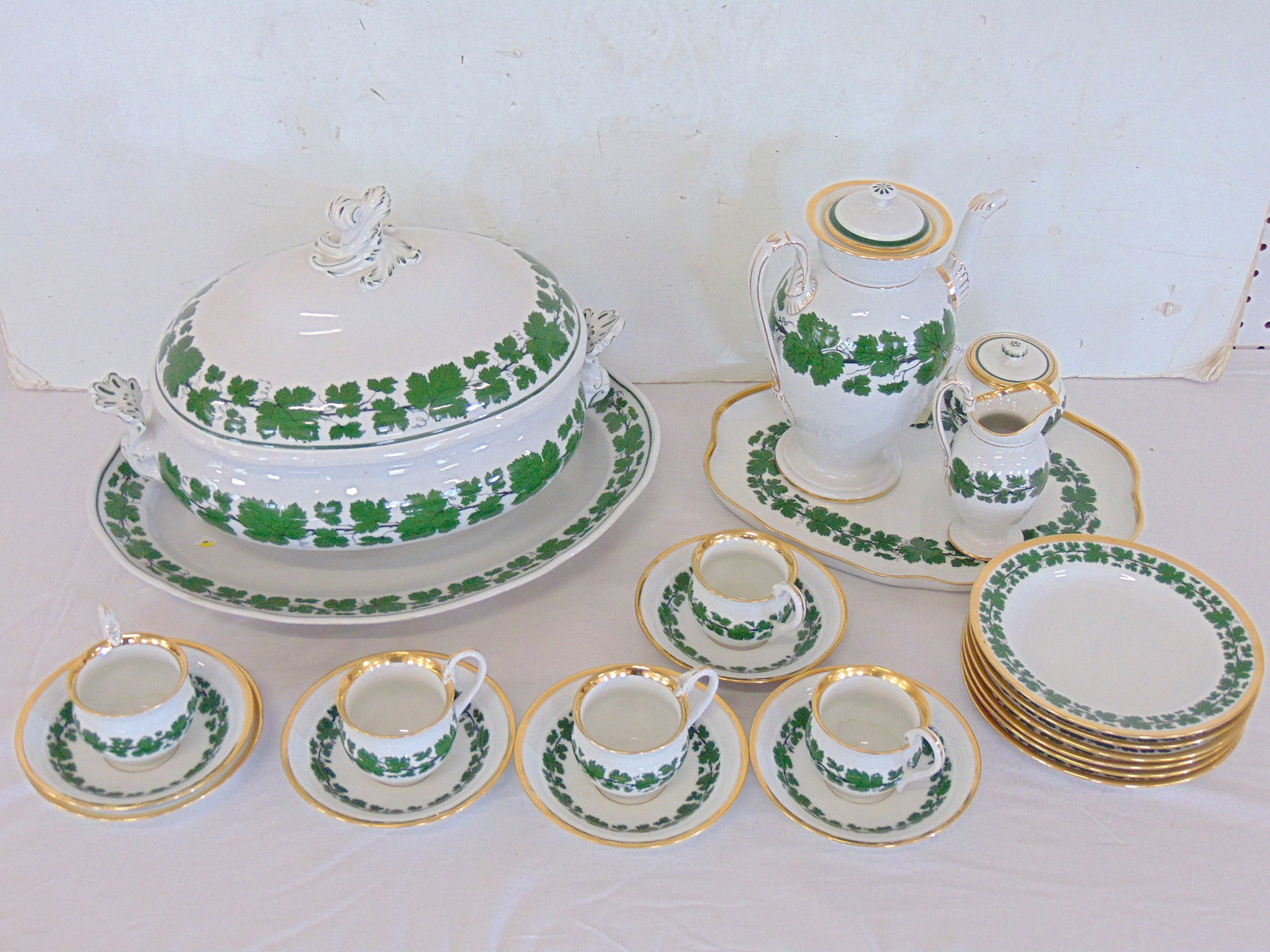 Lot of Meissen "Weinlaub" pattern porcelain, oval charger with tureen, and tea set consisting of: Lot of Meissen "Weinlaub" pattern porcelain, oval charger with tureen, and tea set consisting of teapot, sugar & creamer on serving plate, 6 cake plates and 5 cups with 6 saucers, tea set has gilt acc