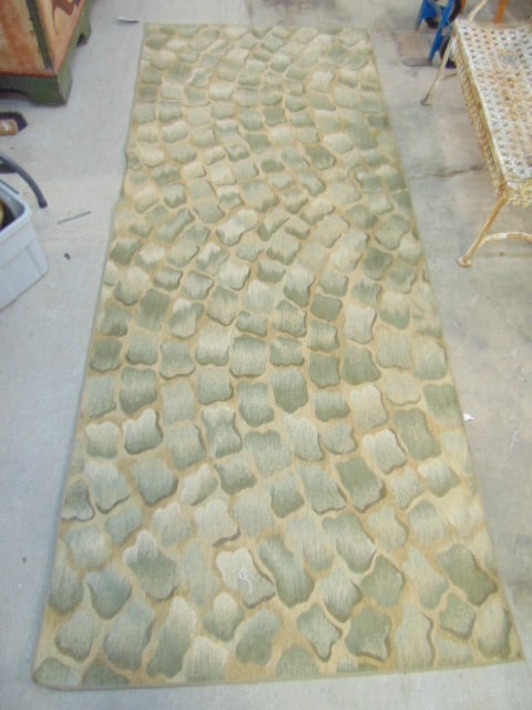 Carpet in green with cobblestone pattern, rug is 10'2" by 4'2" (1 of 5)