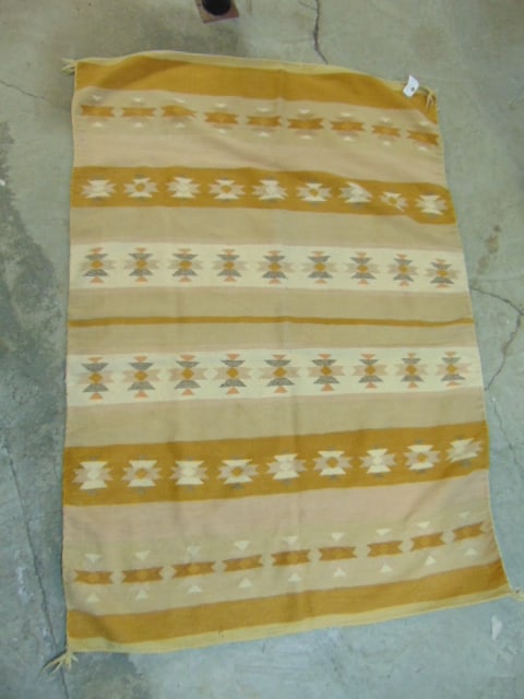 Navajo Chinle rug with banded pattern, in beige, brown, 69.5" by 48", has small hole: Navajo Chinle rug with banded pattern, in beige, brown, 69.5" by 48", has small hole
