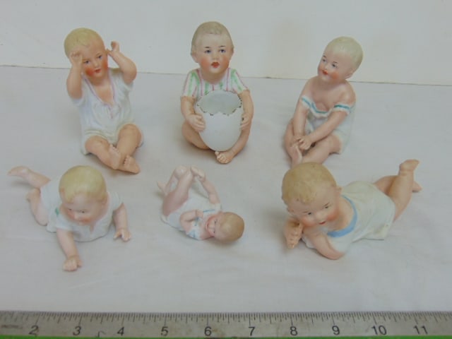 6 bisque porcelain babies, Heubach, one holding egg shell, 2 crawling, 2 sitting, largest figure is: 6 bisque porcelain babies, Heubach, one holding egg shell, 2 crawling, 2 sitting, largest figure is 4.75" tall, in good condition